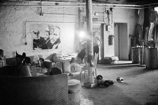 Lou Reed on the sofa, Joseph Freeman with back to camera, and Andy Warhol in the Silver Factory, 1966. 