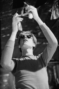 Andy Warhol hanging bananas from the ceiling of the Silver Factory in 1966. 
