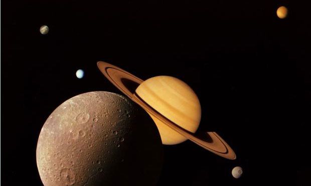 A montage of images of the Saturnian system prepared from an assemblage of images taken by the Voyager 1 spacecraft during its Saturn encounter in November 1980.