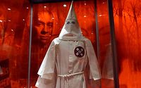 This February 25, 2011 video image shows the image of an African American man behind a Ku Klux Klan (KKK) robe on exibit as part of the 'American I AM: The African Imprint' at the National Geographic 