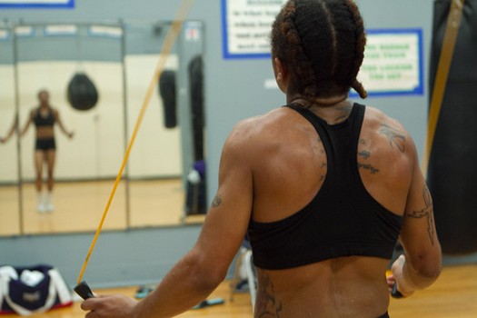 Tyrieshia warms down after a fight.  When she was a teenager, people told her she looked too strong.  “It didn’t affect me,” she says. “My punch affected their face.”