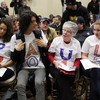 Supporters of republican presidential hopeful U.S. Rep Ron Paul (R-TX) wear t-shirts that spell out 'PAUL' during a campaign stop 