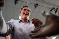 Republican presidential hopeful Mitt Romney greets supporters as he holds a campaign rally at Emma Lou Olson Civic Center in Pompano Beach, Florida, January 29, 2012.