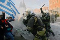 People clash with police in the streets during a demonstration against the new austerity measures on February 12, 2012 in Athens, Greece. 