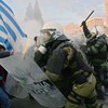 People clash with police in the streets during a demonstration against the new austerity measures on February 12, 2012 in Athens, Greece. 