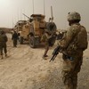 US soldiers keep watch at the entrance of a military base following the shooting of Afghan civilians allegedly committed by a rogue US soldier in Kandahar province on March 11, 2012.