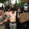 Demonstrators march through downtown streets protesting the NATO Summit on May 20, 2012 in Chicago, Illinois.
