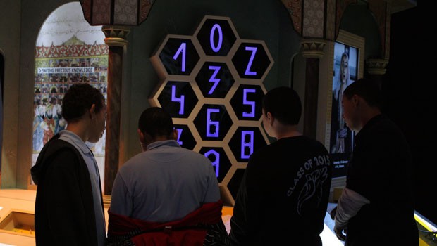 Eight graders from Washington Heights interact with the numbers exhibit. Muslims invented algebra and formalized the use of zero in math.