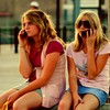 girls talking on cell phones