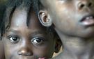 Children wait in line for medical care in Haiti