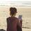 reading a Kindle on the beach
