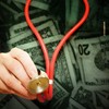 stethoscope with dollar bills money