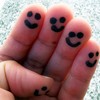 Happy faces on fingertips