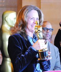 Actress Melissa Leo, who won an Oscar for Best Supporting Actress in The Fighter last year, with the statuette that members of the public can also pose with.