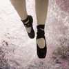 Woman in a Pool with Ballet Shoes On