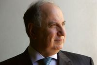 Iraqi Deputy Prime Minister and candidate for parliament Ahmed Chalabi looks from his office window December 5, 2005 in the Green Zone in Baghdad, Iraq.