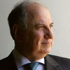 Iraqi Deputy Prime Minister and candidate for parliament Ahmed Chalabi looks from his office window December 5, 2005 in the Green Zone in Baghdad, Iraq.