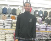 Worker Dillon Saint Claire is trying to support his new wife and infant son on minimum wage. (Cindy Rodriguez/WNYC)