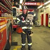 Firefighter Shane Clarke wearing almost 130 pounds of gear.