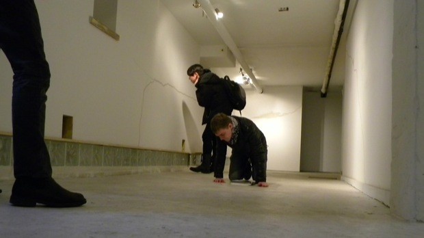 On Your Knees Boy: Gallery goers read Hitchcock's text piece at Famous Accountants.
