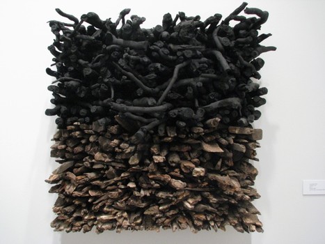 A wood sculpture by Leonardo Drew, titled 'Number 143.'