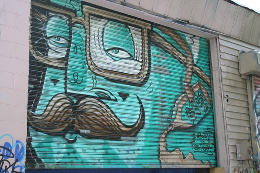 Murals and tags cover most of 5Pointz - even the gates.