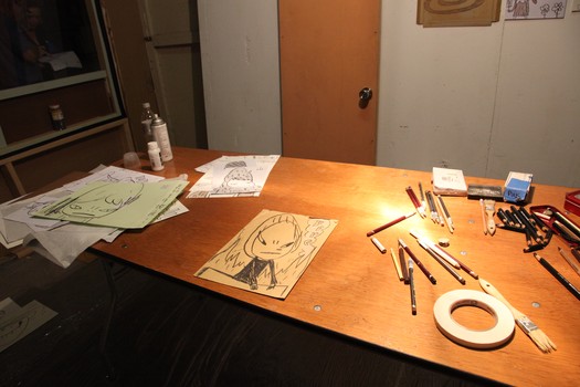 On Nara's desk, one of Nara's famous scowling characters