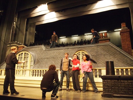 Richard Hake (at center stage) gets direction from dance supervisor.