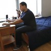 Luiz Perez, 26, in his studio apartment. 