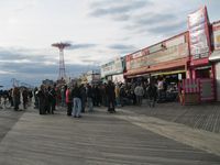 The crowd of protesters spills outside Ruby's Bar on the Coney Island boardwalk