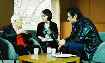 Filmmaker Kaneto Shindo speaks (through a translator) with Benicio Del Toro