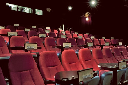 There's no free dishware, but Nighthawk Cinema features dinner and a movie all under the same roof.