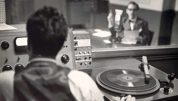 In 1936, Hogan partnered with Elliot Sanger and turned W2XR into WQXR, the first licensed high fidelity station in the U.S. and a commercial venture. Above: an early production booth at 730 Fifth Ave.