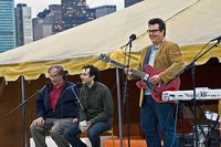 Radiolab hosts Jad Abumrad and Robert Krulwich with John Flansburg of They Might Be Giants