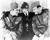 Charles 'Buddy' Rogers, Clara Bow, and Richard Arlen (left to right) on the set of 'Wings'.