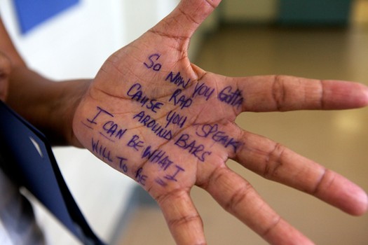Ajani's mother Anthonette Brown with a hand written message from her older son written on her palm.