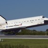 Space shuttle Atlantis' main gear touches down on Runway 33 at the Shuttle Landing Facility at NASA's Kennedy Space Center in Florida.