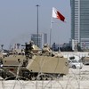A Bahraini army APC pulls out of an area near Pearl Square in Manama on February 19, 2011.