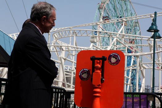 Mayor Michael Bloomberg and Brooklyn Borough President Marty Markowitz flip the switch at Luna Park's Scream Zone, sending two local students flying into the air on the Sling Shot.