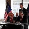 Mayor Michael Bloomberg, Larry Silverstein (L) and William Perlstein (R) signing a lease for William Hale