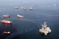 JULY 18: Oil sheen is seen with vessels assisting near the source of the BP Deepwater Horizon oil spill on July 18, 2010 in the Gulf of Mexico off the coast of Louisiana. 