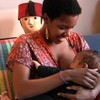 Valery Upson prepares to feed her son.