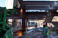 Workers at the Deutsche Bank dismantling steel beams