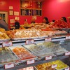 People are lined up to get their sweets at Delhi Palace on 74th St. in Jackson Heights.