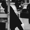 Man ducking into phone booth