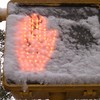 Snow on a walk sign on the Upper West Side. 