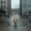 Nancy Zakhary and Eddie Lima of Brooklyn wade through flood waters filling the intersection of Main St and Plymouth St in Dumbo Brooklyn as Hurricane Irene reaches the New York City Area on August 28,