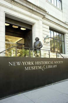 The exterior of the newly remodelled New York Historical Society Museum and Library. A bronze statue of Frederick Douglass greets visitors.
