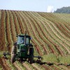 Tractors work in northern Maine potato fields.