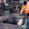 Department of Transportation filling potholes